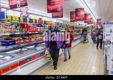 People shopping for food in the days before Christmas, Lidl supermarket, UK Stock Photo