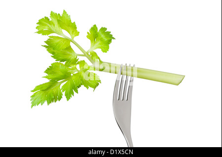 fresh celery stick or stalk on a fork isolated against a white background Stock Photo