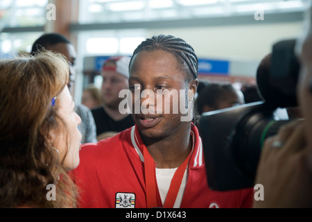 Custio Clayton, a Canadian Olympic boxer, returning from the London 2012 olympics, is greeted at Halifax airport Stock Photo