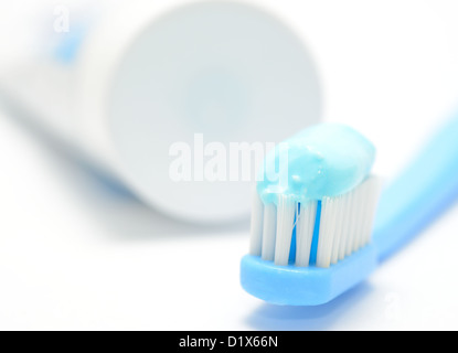 Macro shot of toothbrush and toothpaste on the white background. Stock Photo