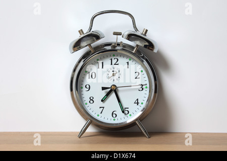 Old style chrome alarm clock with two bells. Stock Photo