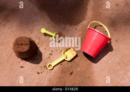 Bucket, spade and sandcastle on the beach of Burncoat Head, Bay of Fundy Stock Photo