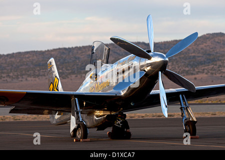 A Precious Metal crew member tends to the P-51 Mustang Unlimited Air Racer during the 2012 Reno National Championship Air Races Stock Photo