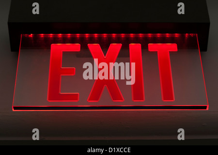 Red illuminated exit sign Stock Photo