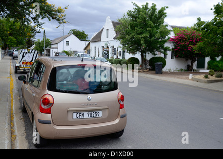 Car in street of Montague, Western Cape, South Africa. Historic Cape Dutch houses in background Stock Photo