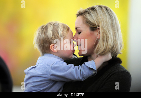 Bettina, wife of German President Christian Wulff, cuddles son Linus while guiding carollers of the diocese in Hamburg through the Bellevue Palace in Berlin, Germany, 06 January 2011. The carollers bless the Bellevue Palace and collect money for charity projects. Photo: Hannibal Stock Photo