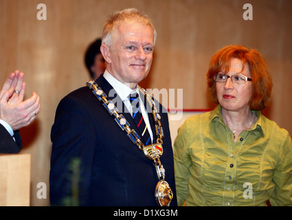 Fritz Kuhn, new mayor of Stuttgart, is presented the chain of office by Silvia Fischer (R), chairwoman of the Greens parliamentary group in the Stuttgart council, during his assumption of office at the city hall in Stuttgart, Germany, 07 January 2013. Photo: BERND WEISSBROD Stock Photo