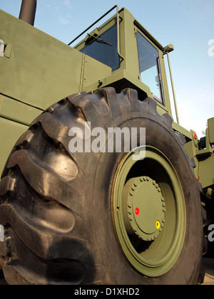 Massive tire of a military earth moving equipment vehicle Stock Photo
