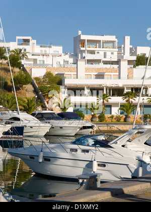 Cala d'Or, Mallorca, Balearic Islands, Spain. Luxury yachts moored in the Port Petit marina in Cala Llonga. Stock Photo