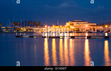 Port de Pollença, Mallorca, Balearic Islands, Spain. View across the illuminated harbour by night. Stock Photo