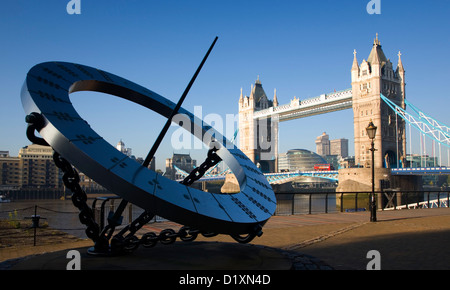 London, Greater London, England. View to Tower Bridge from St Katharine's Dock, sundial sculpture in foreground. Stock Photo
