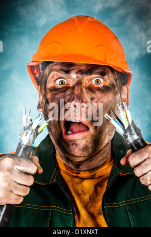 Electric shock sees a shocked electrician man Stock Photo