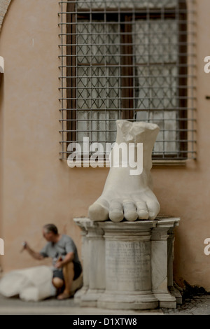 the Ancient giant marble foot statue part of a Roman monument in Via ...