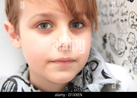 Sad child looking into camera Stock Photo