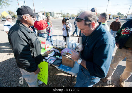 Jan. 8, 2013 - Tucson, Arizona, U.S - FRANK ANTENORI, a former GOP candidate for the US House and state legislator, right, speaks with HAROLD LEWIS, left, a gun owner hoping to sell his 9mm pistol for $350 in lieu of a $50 grocery store gift card.  Antenori announced he'd be buying guns he liked on the sidewalk adjacent to a buyback event held at a police station. (Credit Image: © Will Seberger/ZUMAPRESS.com) Stock Photo