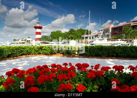 A springtime view of Harbour Town Marina on Hilton Head Island, SC with red azalea in bloom. Stock Photo