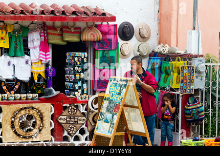 Man and young  girl outside a shop in Todos Santos, Baja, Mexico Stock Photo