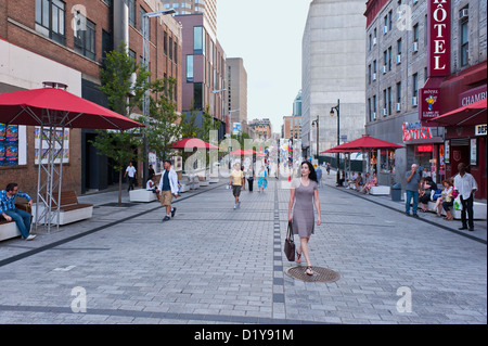 Pedestrians on a part Ste Catherine street which is closed to ...