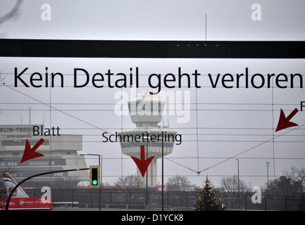 This poster hangs at the entrance to Tegel Airport in Berlin, Germany, 08 January 2013. After the opening of the new BER Aiport has been postponed again, operations at Tegel with be continued for an indefinite period. Photo: PAUL ZINKEN Stock Photo