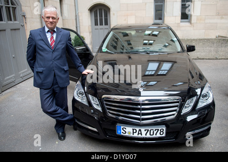 The new Mayor of Stuttgart Fritz Kuhn stands in the courtyard of city hall next to his official car, a Mercedes-Benz E300 BlueTec Hybrid, during a press tour the day after being sworn in in Stuttgart, Germnay, 08 January 2013. Photo: MARIJAN MURAT Stock Photo