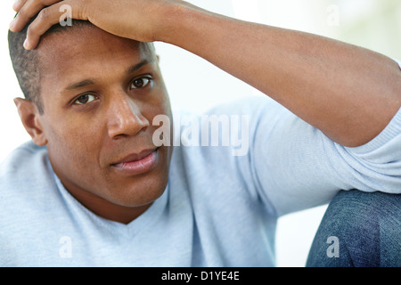 Image of calm African man looking at camera Stock Photo