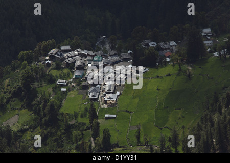 Grahan Village near Kasol in Himachal Pradesh, Indian Himalaya surrounded by green farms. Stock Photo