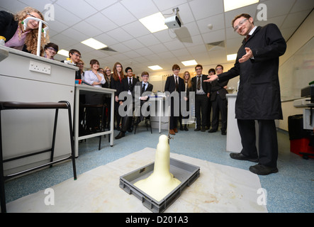 A teacher demonstrates a chemistry experiment during a science lesson at Pates Grammar School in Cheltenham, Gloucestershire UK Stock Photo