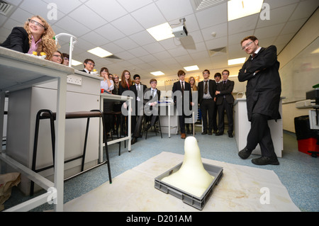 A teacher demonstrates a chemistry experiment during a science lesson at Pates Grammar School in Cheltenham, Gloucestershire UK Stock Photo