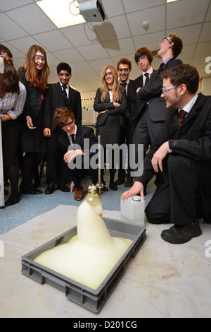 A teacher demonstrates a chemistry experiment during a science lesson at Pates Grammar School in Cheltenham, Gloucestershire UK Stock Photo
