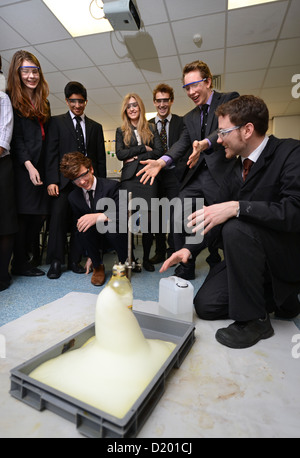 A teacher demonstrates a chemistry experiment during a science lesson at Pates Grammar School in Cheltenham, Gloucestershire UK Stock Photo