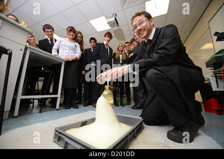 A teacher demonstrates a chemistry experiment during a science lesson at Pates Grammar School in Cheltenham, Gloucestershire UK Stock Photo