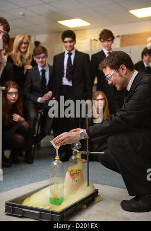 A teacher demonstrates a chemistry experiment during a science lesson at Pates Grammar School in Cheltenham, Gloucestershire UK Stock Photo