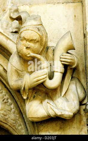 Beverley Minster, Medieval carved stone Musician, wind instrument, horn, music, musicians musical, Yorkshire, England UK Stock Photo