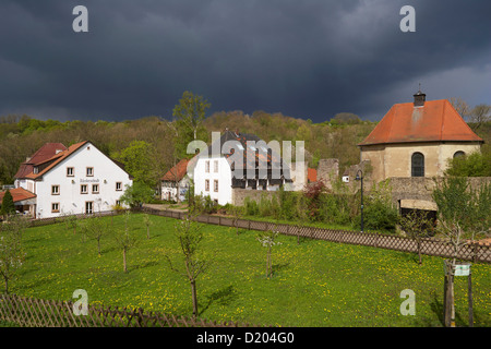Graefinthal with rest of former Wilhelmiten monastery under thunder clouds, Mandelbachtal, Bliesgau, Saarland, Germany, Europe Stock Photo
