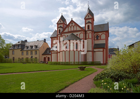 St. Peter's church with garden under clouded sky, Merzig, Saarland, Germany, Europe Stock Photo