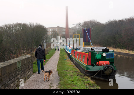 Bollington, Cheshire, UK. Aqueduct carrying the Macclesfield Canal, with the converted Clarence Mill in the distance. Stock Photo