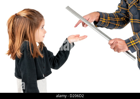 Young girl being physically punished by adult with a ruler Stock Photo