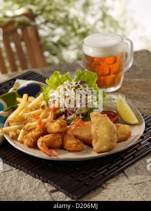 Fried shrimp and fish meal in an outdoor setting Stock Photo