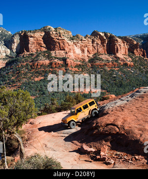 Four-wheel-drive vehicle exploring steep grade in Sedona, Arizona Stock Photo