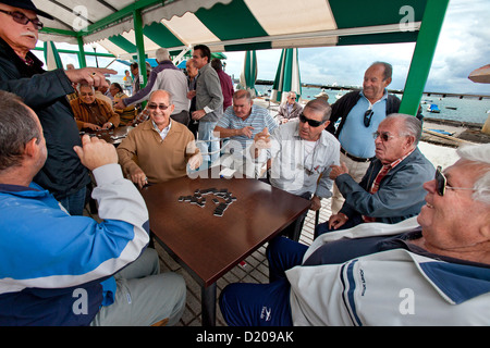 Old men playing domino in the evening, Arrecife, Lanzarote, Canary Islands, Spain, Europe Stock Photo