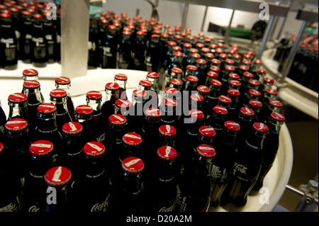 July 5, 2012 - Atlanta, GA - World of Coca-Cola is a permanent exhibition featuring the history of the Coca-Cola Company. The museum, located on a 20-acre complex near Atlanta's Centennial Olympic Park, welcomes more than 1 million visitors each year. It is a few blocks from Coca-Cola's world headquarters..PICTURED: Bottles of Coca-Cola produced in the museum are given to each visitor (Credit Image: © Robin Nelson/ZUMAPRESS.com) Stock Photo