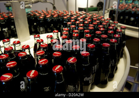 July 5, 2012 - Atlanta, GA - World of Coca-Cola is a permanent exhibition featuring the history of the Coca-Cola Company. The museum, located on a 20-acre complex near Atlanta's Centennial Olympic Park, welcomes more than 1 million visitors each year. It is a few blocks from Coca-Cola's world headquarters..PICTURED: Bottles of Coca-Cola produced in the museum are given to each visitor (Credit Image: © Robin Nelson/ZUMAPRESS.com) Stock Photo