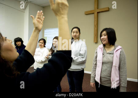 Jan. 28, 2012 - Norcross, GA - Korean youth with various developmental, mental and physical disabilities (autism, Downs syndrome, etc.) spend Saturdays at Wheat Mission in Norcross, GA Pictured: Girls practice singing Korean hymns. (Credit Image: © Robin Nelson/ZUMAPRESS.com) Stock Photo