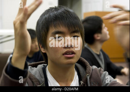 Jan. 28, 2012 - Norcross, GA - Korean youth with various developmental, mental and physical disabilities (autism, Downs syndrome, etc.) spend Saturdays at Wheat Mission in Norcross, GA Pictured: boy with autism sings Korean songs. (Credit Image: © Robin Nelson/ZUMAPRESS.com) Stock Photo