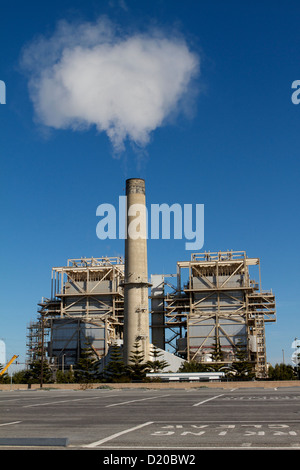 AES Huntington Beach Generating power Station with steam rising from one of its stacks Stock Photo