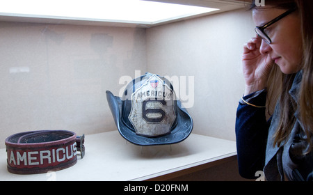 A woman views a belt from the movie 'Gangs of New York' exhibited at the 'Martin Scorsese' exhibition at the Museum for Film and Television in Berlin, Germany, 09 January 2013. The exhibition is running from 10 January until 12 May. Photo: JOERG CARSTENSEN Stock Photo