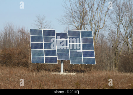 Solar Panels erected in an open field Stock Photo