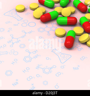 3D model of yellow pills and red green capsules on chemical diagram Stock Photo