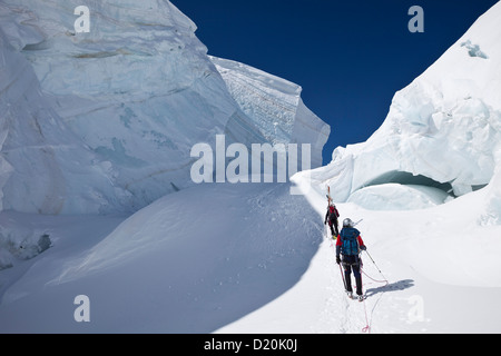 Ski mountaineers in a crevasse, Mont Blanc du Tacul, Chamonix, Mont-Blanc, France Stock Photo