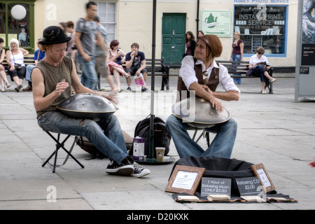 Two street musicians playing an instrument called Hang, which is made in Switzerland. Stock Photo